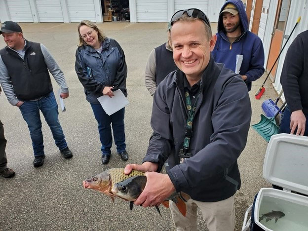 Lt. Stroess explains the differences between bigmouth buffalo and common carp — two of the most abundant commercial fish species on the Mississippi River system.
