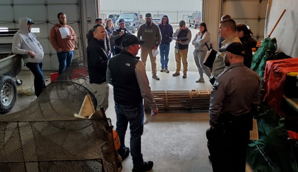 Looking at various Mississippi River commercial fishing gear, including fyke net, slat trap, gill net, trammel net, bait net, buffalo net and seine.