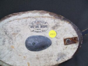 C. V. Wells decoy showing the ink stamp on the bottom
