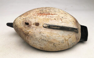 The bottom of a George H. Bacon Goldeneye Hen decoy