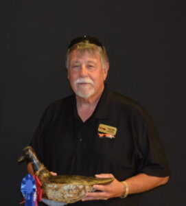 Bruce Urben, shown here with a winning decoy in Wisconsin’s 2018 Decoy Carving Contest